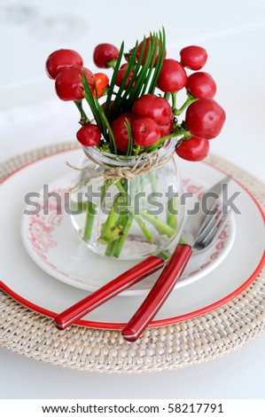place setting  with Decorative peppers centerpiece