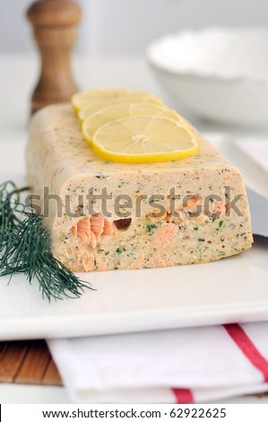 Fresh and smoked salmon terrine garnish with lemon