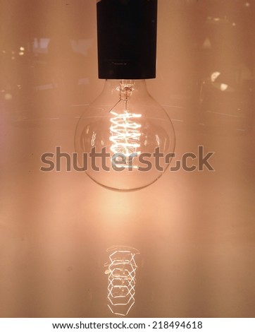 An electric bulb lit to illustrate the energy consumption