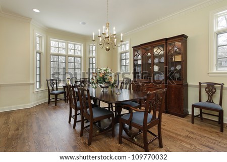 Dining room in suburban home with cream colored walls