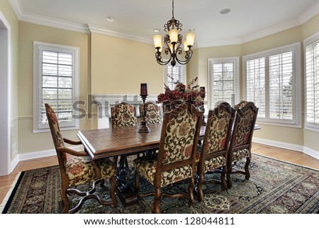 Dining room in luxury home with white fireplace