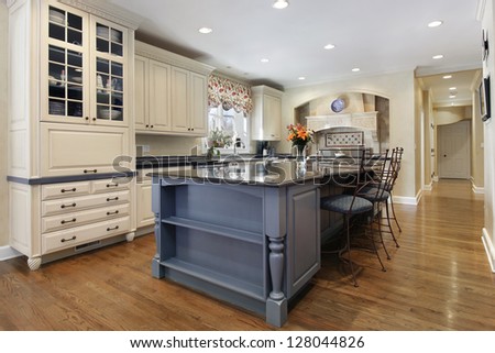 Upscale Kitchen With A Gray Cabinet Granite Island