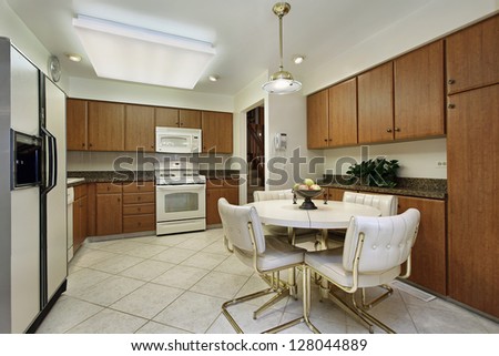 Kitchen in suburban home with wood cabinets
