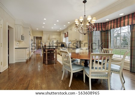 Large kitchen in suburban home with eating area