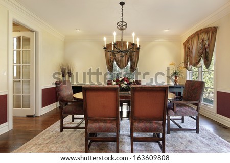 Dining Room In Luxury Home With Cream Colored Walls