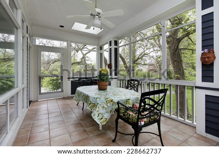 Porch in suburban home with tile floor