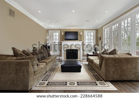 Family room in luxury home with wall of windows