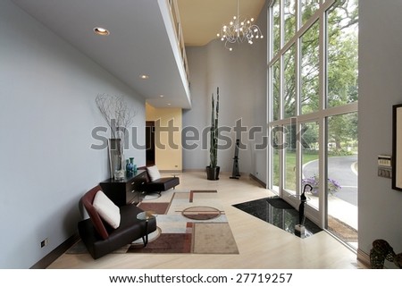Foyer in luxury home with two story windows