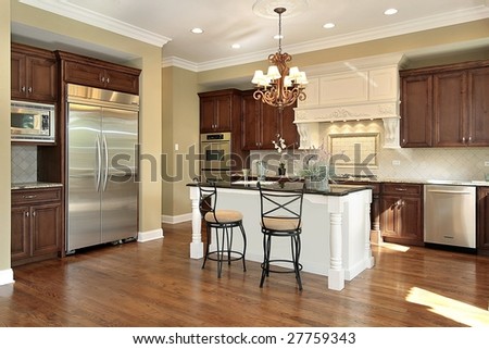 Kitchen and island with wood cabinetry