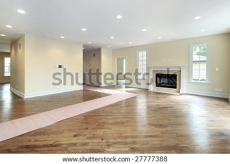 New construction family room with paper walkway