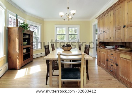 Dining room in suburban home with wood cabinetry
