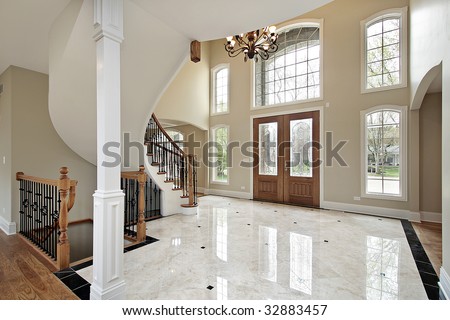 Foyer And Circular Staircase In New Construction Home Stock Photo ...