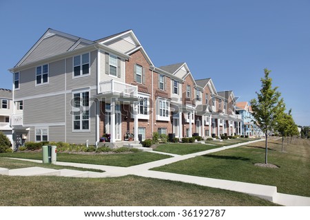 Brick townhouses and new construction townhouses in suburban development