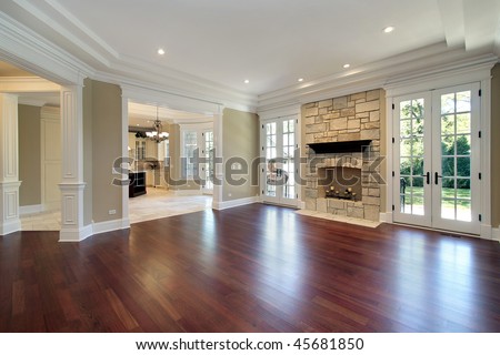 Living room in new construction home with stone fireplace