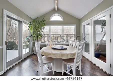 Eating area in suburban home with doors to patio