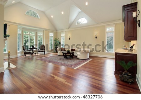Family room in luxury home with curved windows