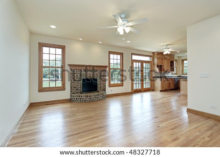 Family room with kitchen view and brick fireplace