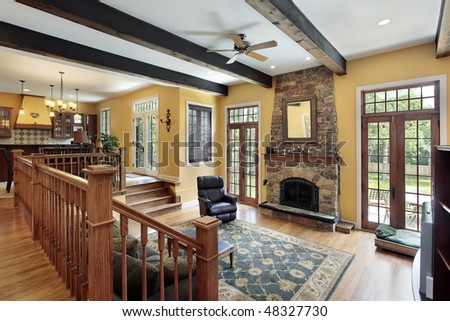 Family room in luxury home with wood ceiling beams