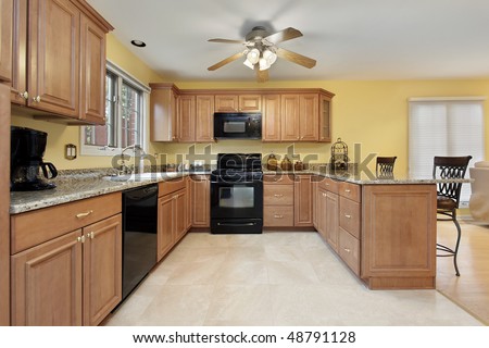 Kitchen in suburban home with black appliances