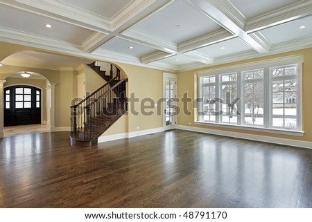 Family room in new construction home with view into foyer