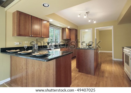 Kitchen in remodeled home with granite counters