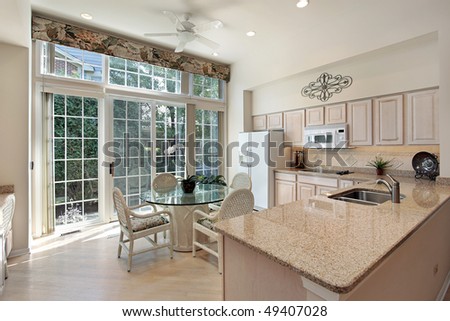 Kitchen in suburban home with sliding doors to patio