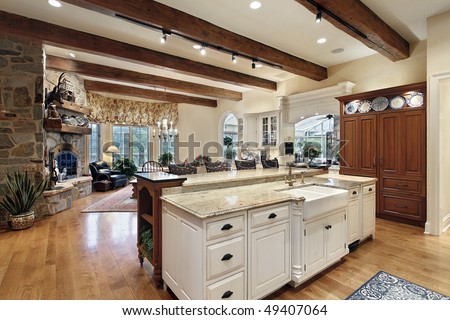 Kitchen in luxury home with stone fireplace