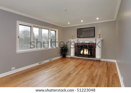 Family room in remodeled home with brick fireplace