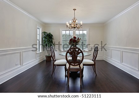 Dining room in luxury home with dark wood flooring