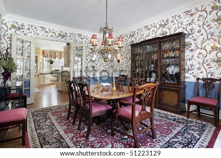 Dining room in luxury home with floral wallpaper