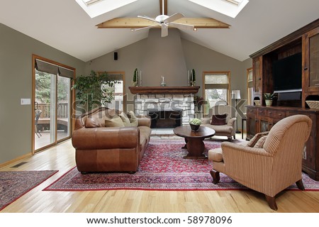 Family room with skylights and white brick fireplace