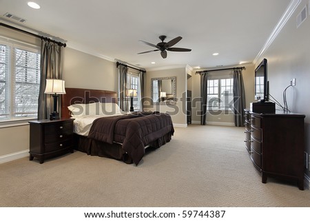Black Wood Furniture on Master Bedroom In Luxury Home With Dark Wood Furniture Stock Photo
