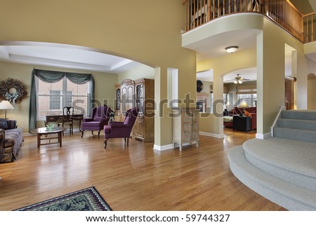 Foyer in upscale home with living room view