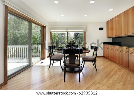 Breakfast room in luxury home with door to deck