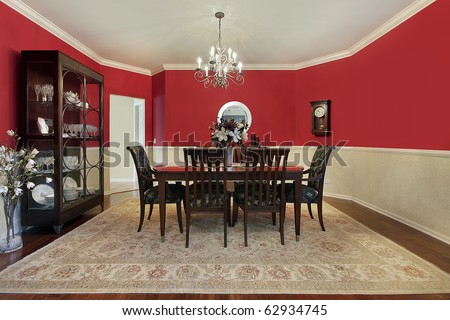 Dining room in suburban home with red walls
