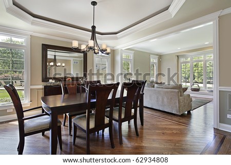 Dining room in luxury home with view into living area