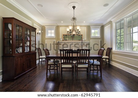 Dining room in luxury home with stone fireplace