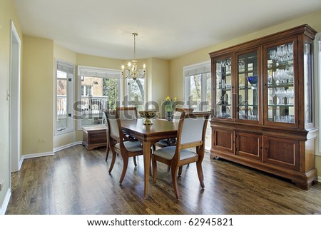 Dining room with large wood and glass buffet