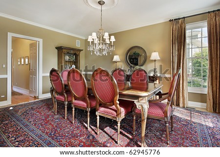 Dining room in luxury home with gold walls