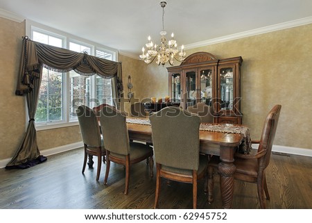 Dining room in luxury home with wood buffet