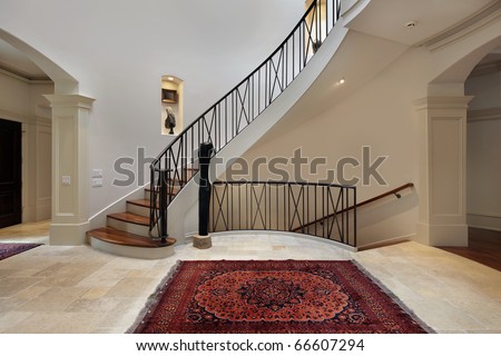 Large Foyer In Luxury Home With Circular Staircase Stock Photo ...