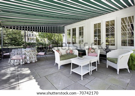 Patio in luxury home with green awning