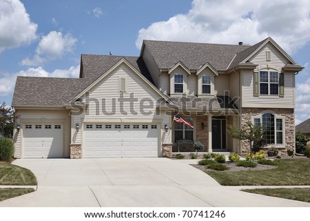 Home with covered entry and double three car garage