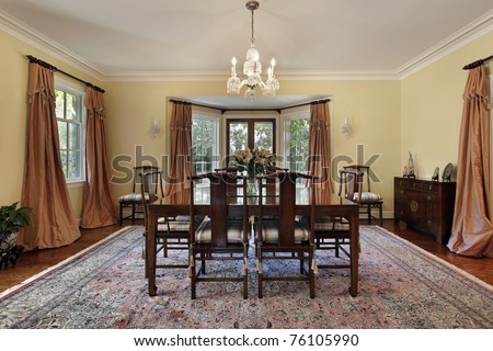 Dining room in suburban home with doors to patio