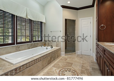 Master bath in luxury home with floor design