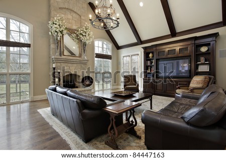 Sala dos Professores Stock-photo-family-room-in-luxury-home-with-two-story-stone-fireplace-84447163