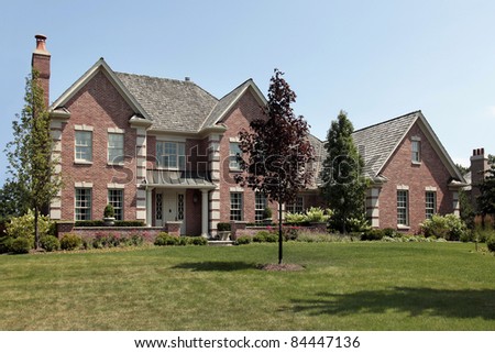 Large brick home with white front columns