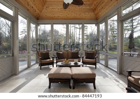 Porch in luxury home with wood ceiling