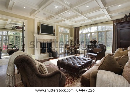 Large family room with fireplace and wall of windows