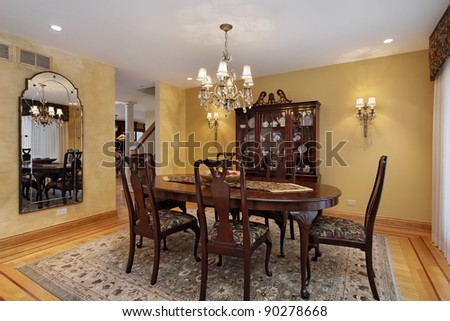 Dining room with buffet and gold walls
